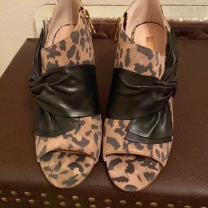 Leopard open toe heels with side leather bows, & inside zipper.
